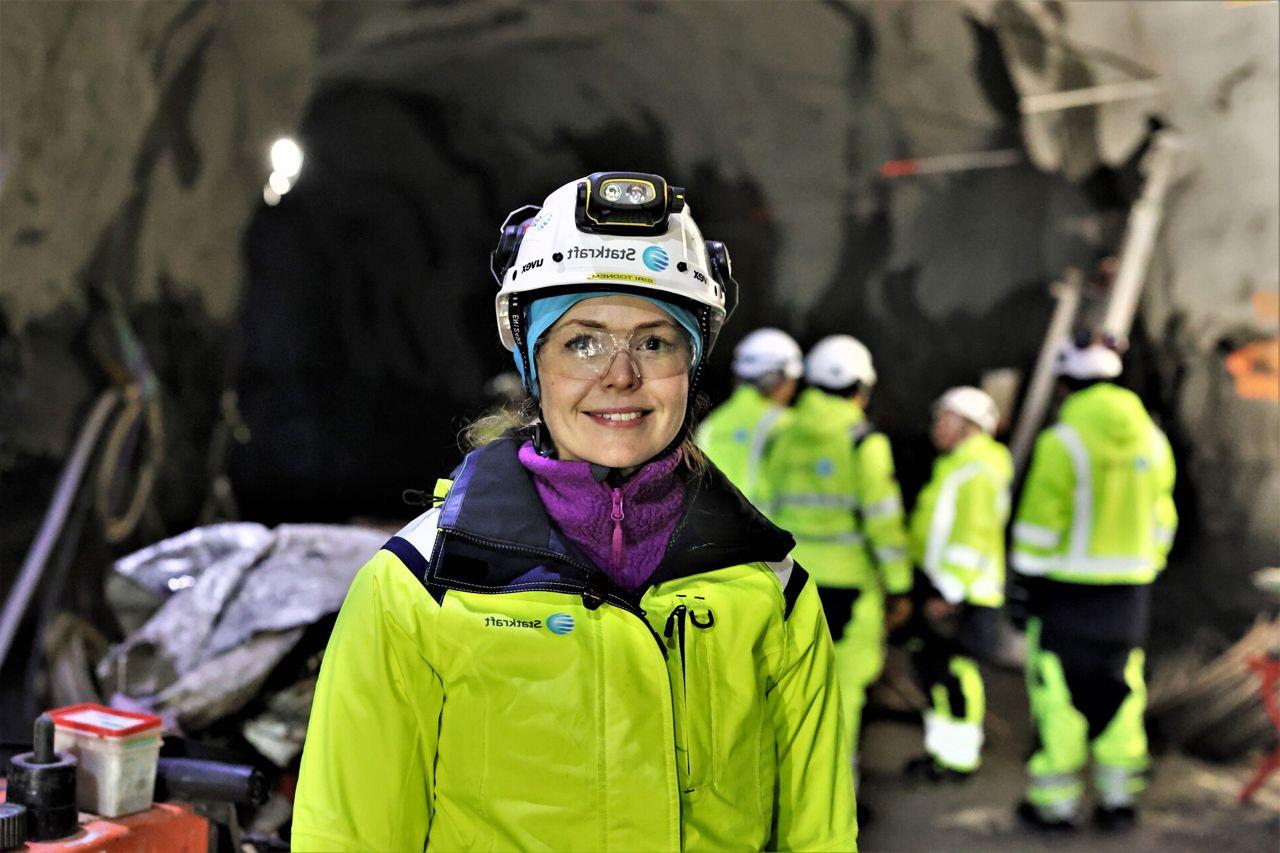 Woman smiling wearing safety gear